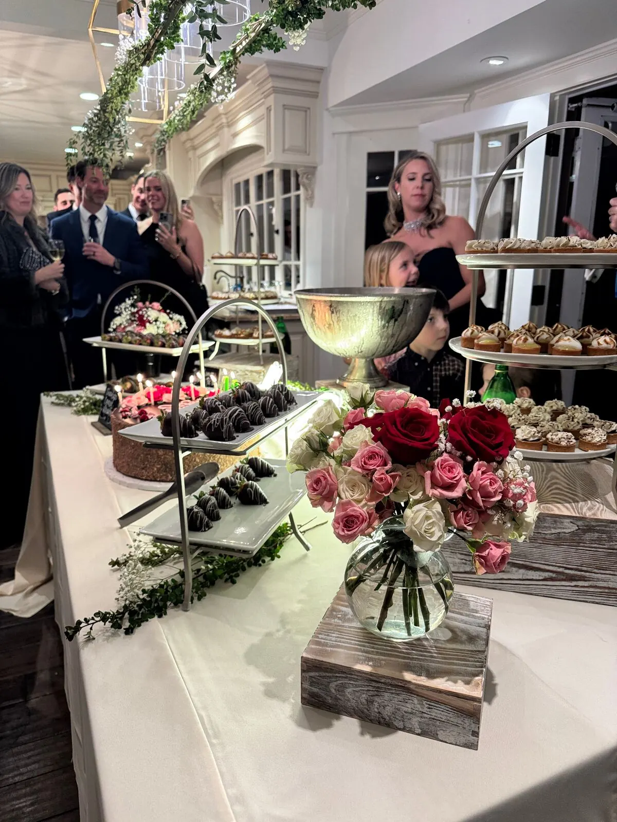 Wedding dessert display with cake, tarts, and sweets at a San Francisco reception catered by Winslow's Catering