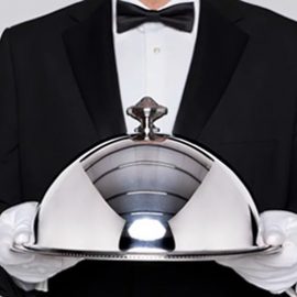 Winslow's waiter holding the dish at a dinner party in SF