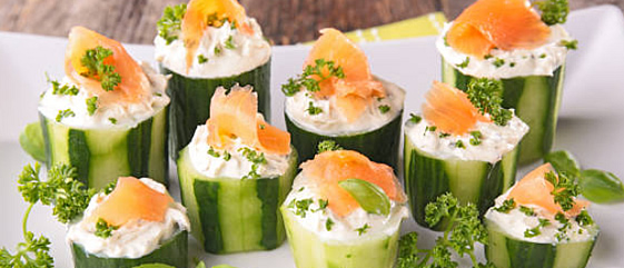 Cucumber bite appetizers decorated with salmon