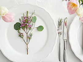 White plate with flower, and knife and fork